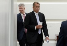 US Speaker of the House John Boehner (C) walks into a meeting with House Republicans, on Capitol Hill in Washington DC, USA, 28 September 2013. In the face of a looming government shutdown, the House must decide what to do with a Senate-passed, temporary budget bill that doesn't defund the Affordable Care Act, or 'Obamacare'. EFE/EPA/MICHAEL REYNOLDS